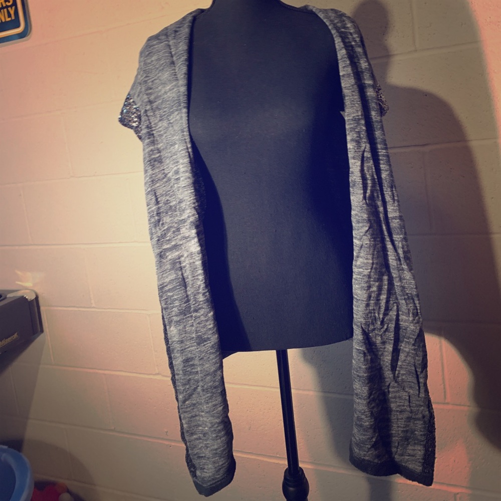 A pretty gray and black sparkly vest